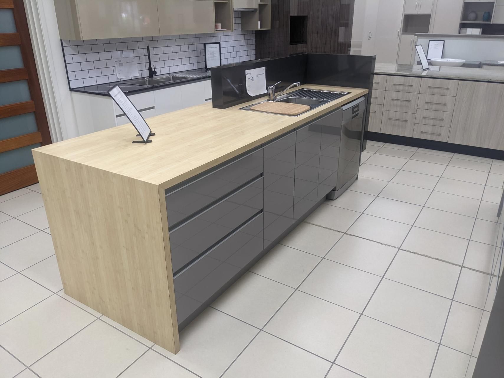 A Kitchen With a Large Island in the Middle of It — Ross Joinery Kitchens In Garbutt, QLD