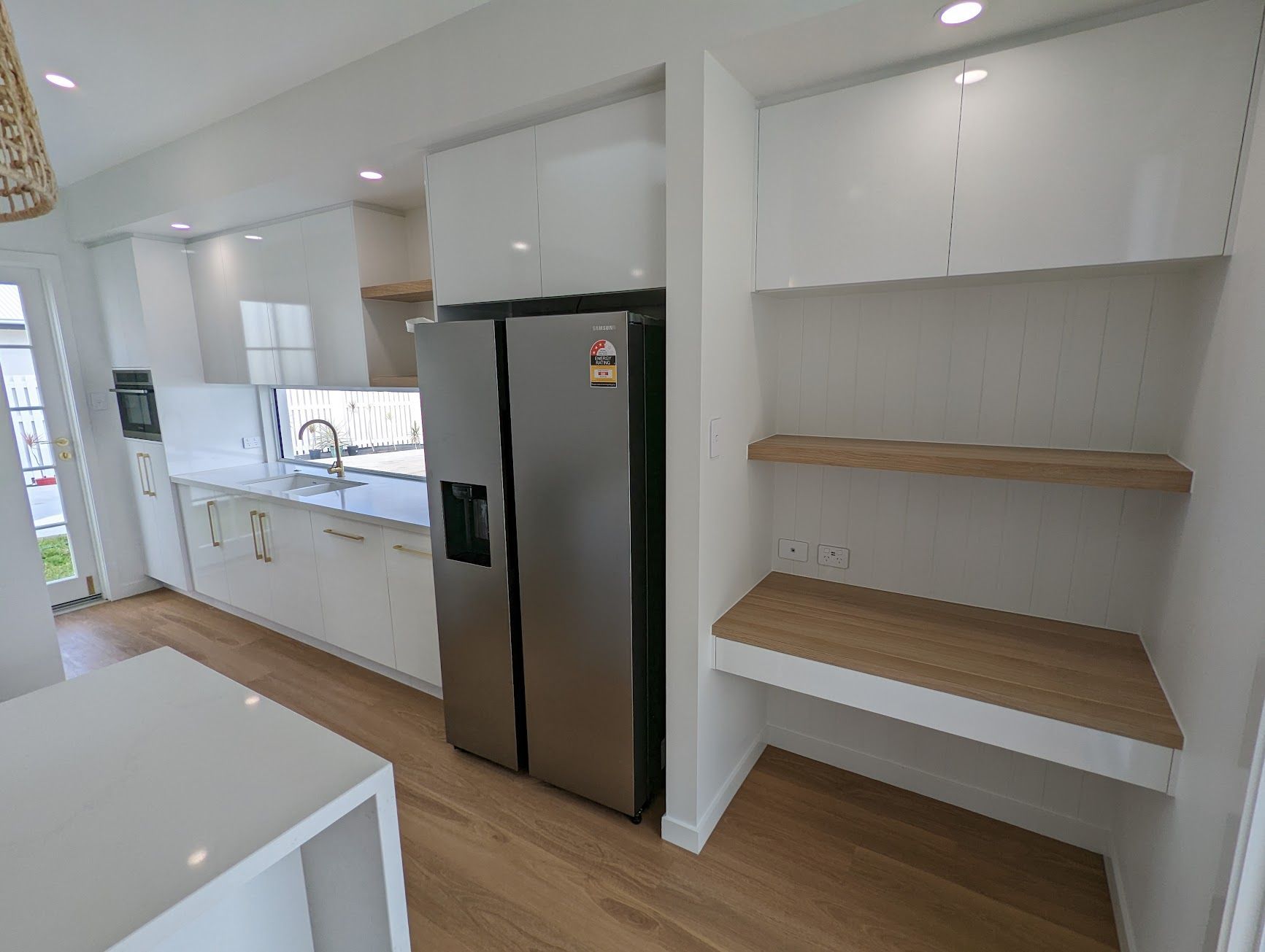 A Kitchen With a Large Island in the Middle — Ross Joinery Kitchens In Garbutt, QLD