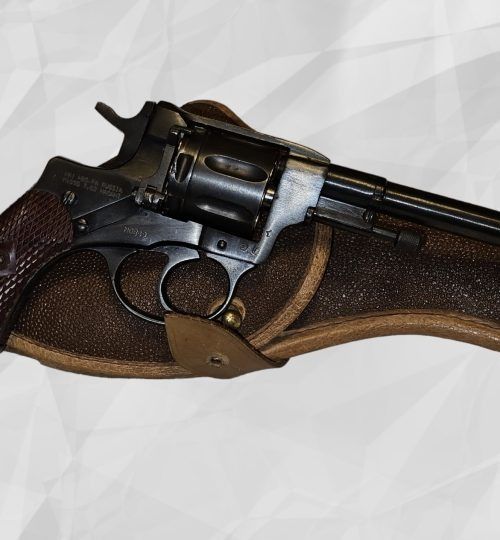 Close-up of a black revolver in a brown leather holster on a white background