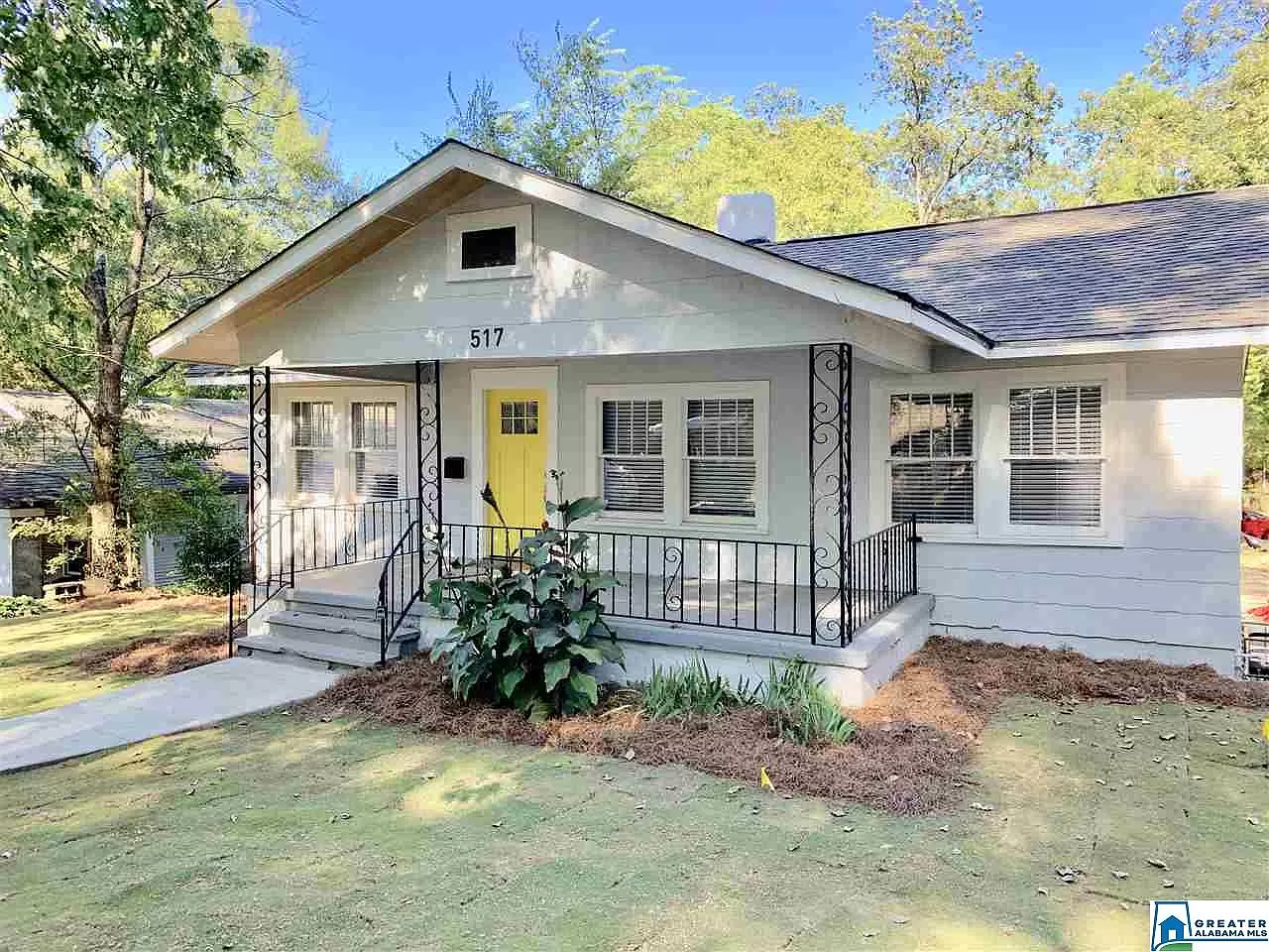 house with yellow door after remodel