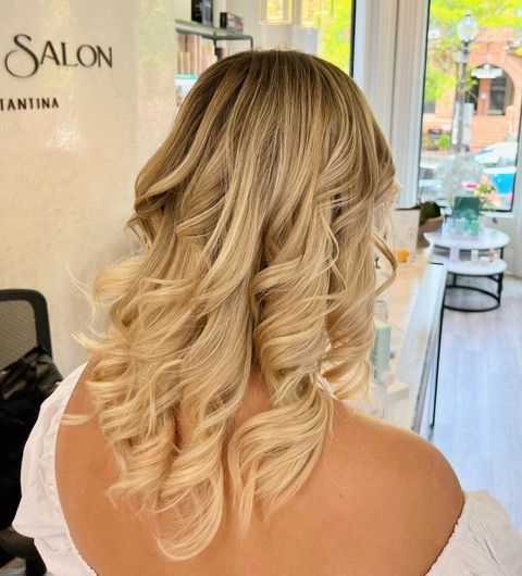Blonde wavy shoulder-length hairstyle from behind