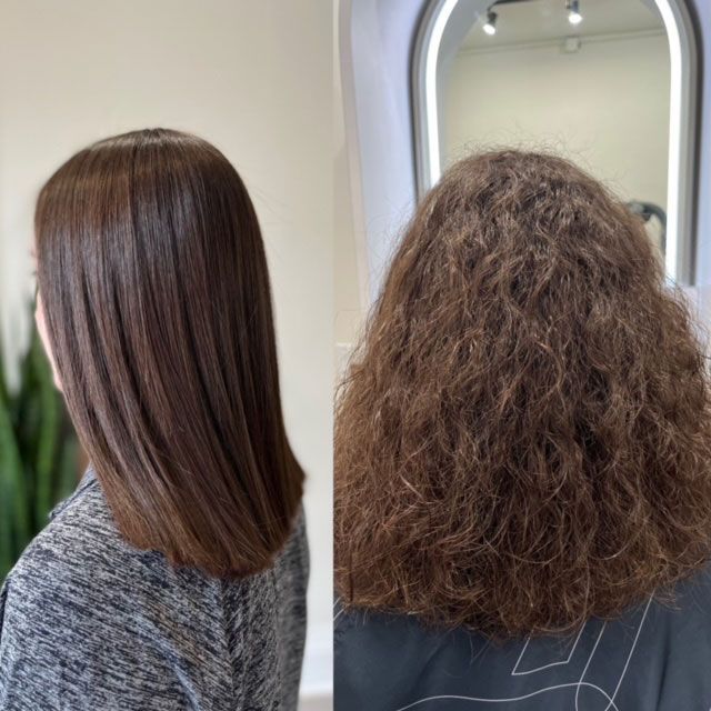 Side-by-side view of straight, smooth brown hair and curly, frizzy brown hair in a salon mirror