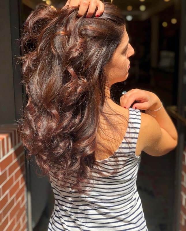 Woman with wavy brown hair