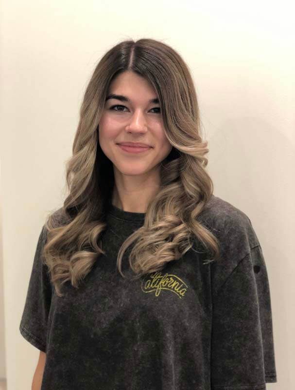 Person with long wavy, balayage hair