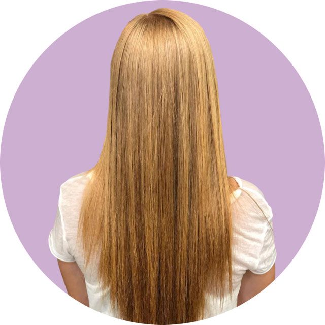 Long straight blonde hair shown from the back