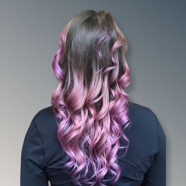 Back view of long wavy hair fading from dark brown
