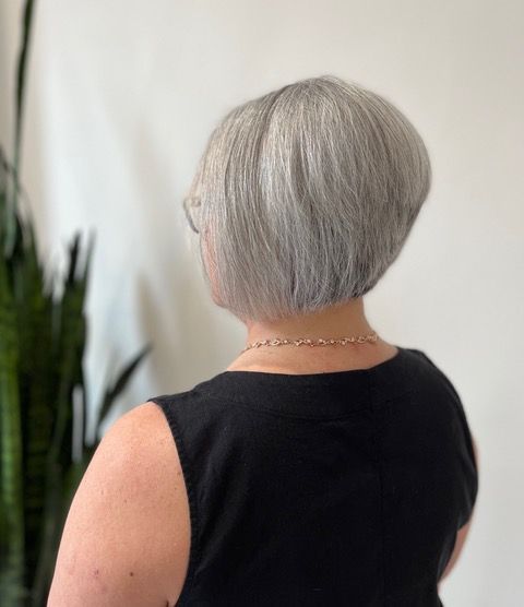 Back view of a person with short silver bob
