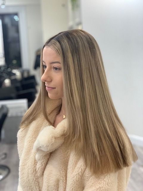 Side view of a woman with straight blonde