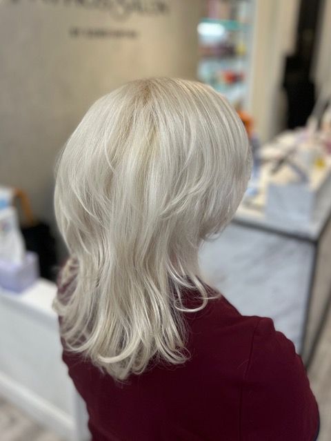 Platinum blonde layered hairstyle from the back