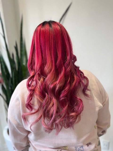 Back view of long wavy pink hair