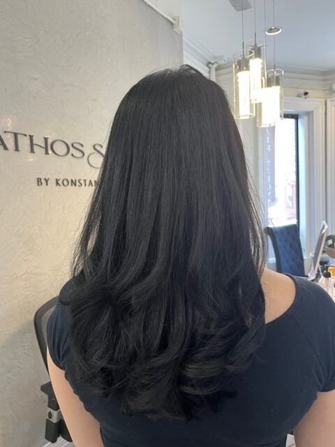 Back view of a person with long dark hair