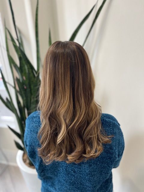 Person with shoulder-length wavy brown hair