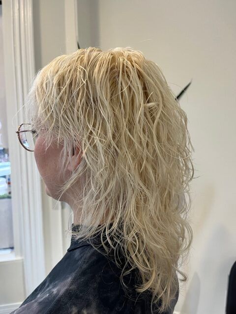 Side profile of a person with blonde hair