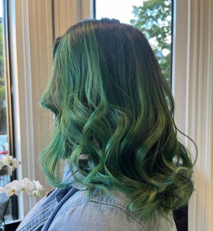 Wavy green-dyed hair