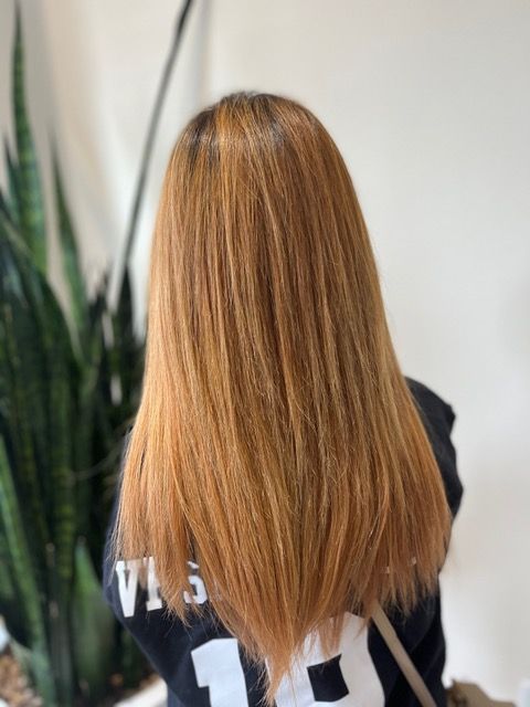 Person with long straight light brown hair