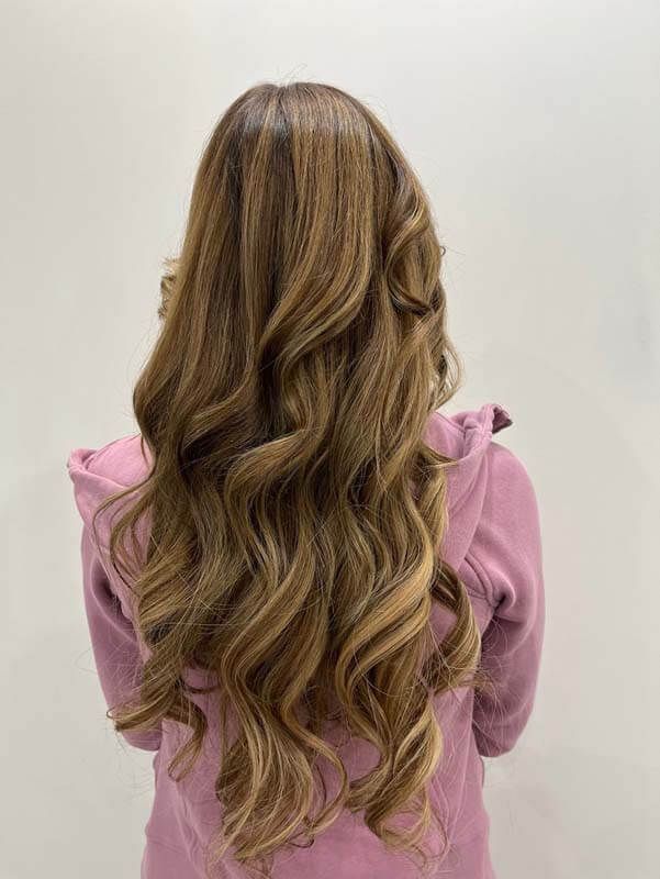 Back view of long wavy blonde hair