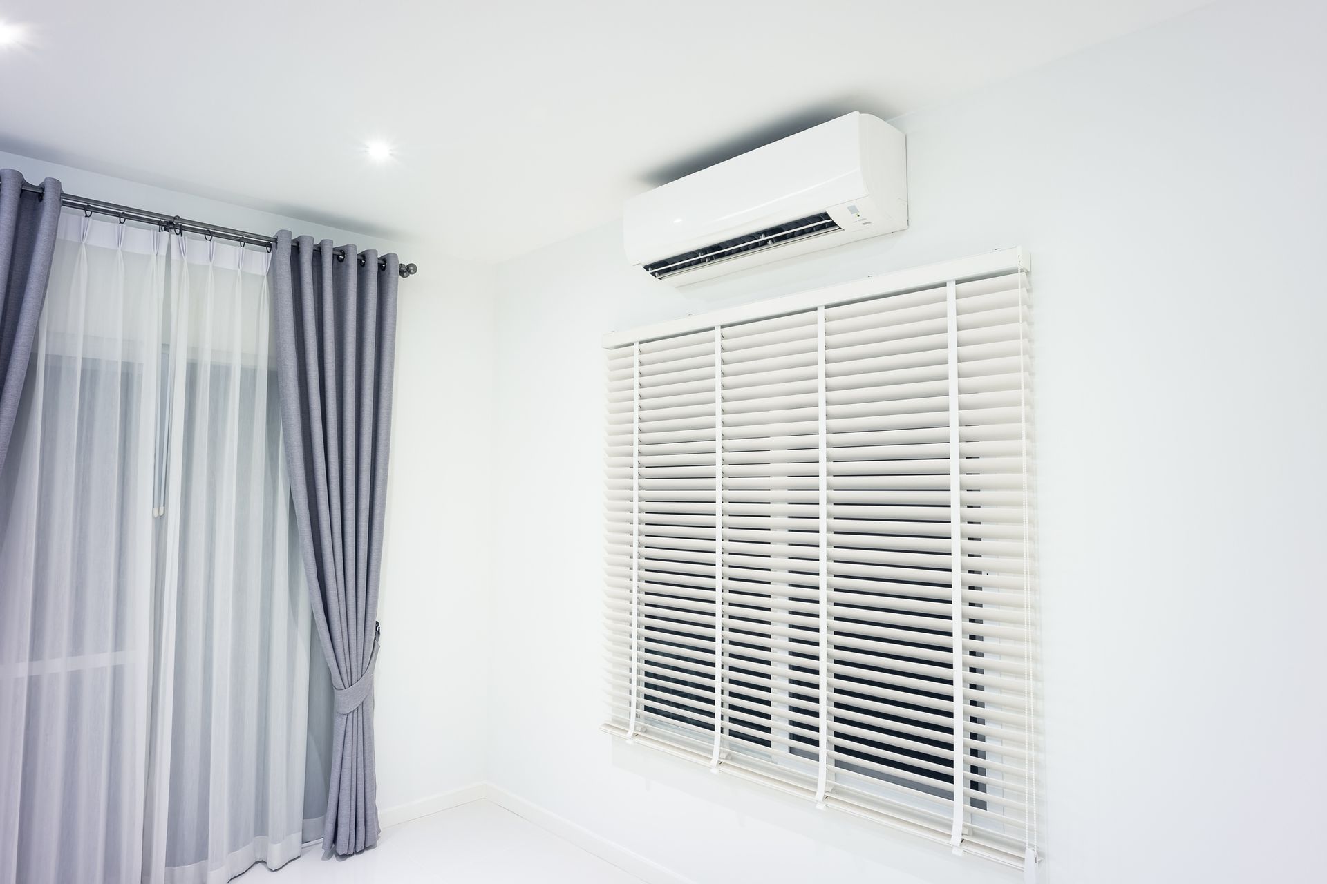 Blinds and Air Conditioner in Room — San Jose, CA — Lorenzo Heating & Cooling