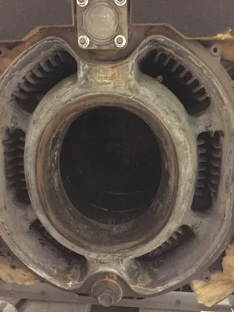 A close up of a metal object with a hole in the middle.