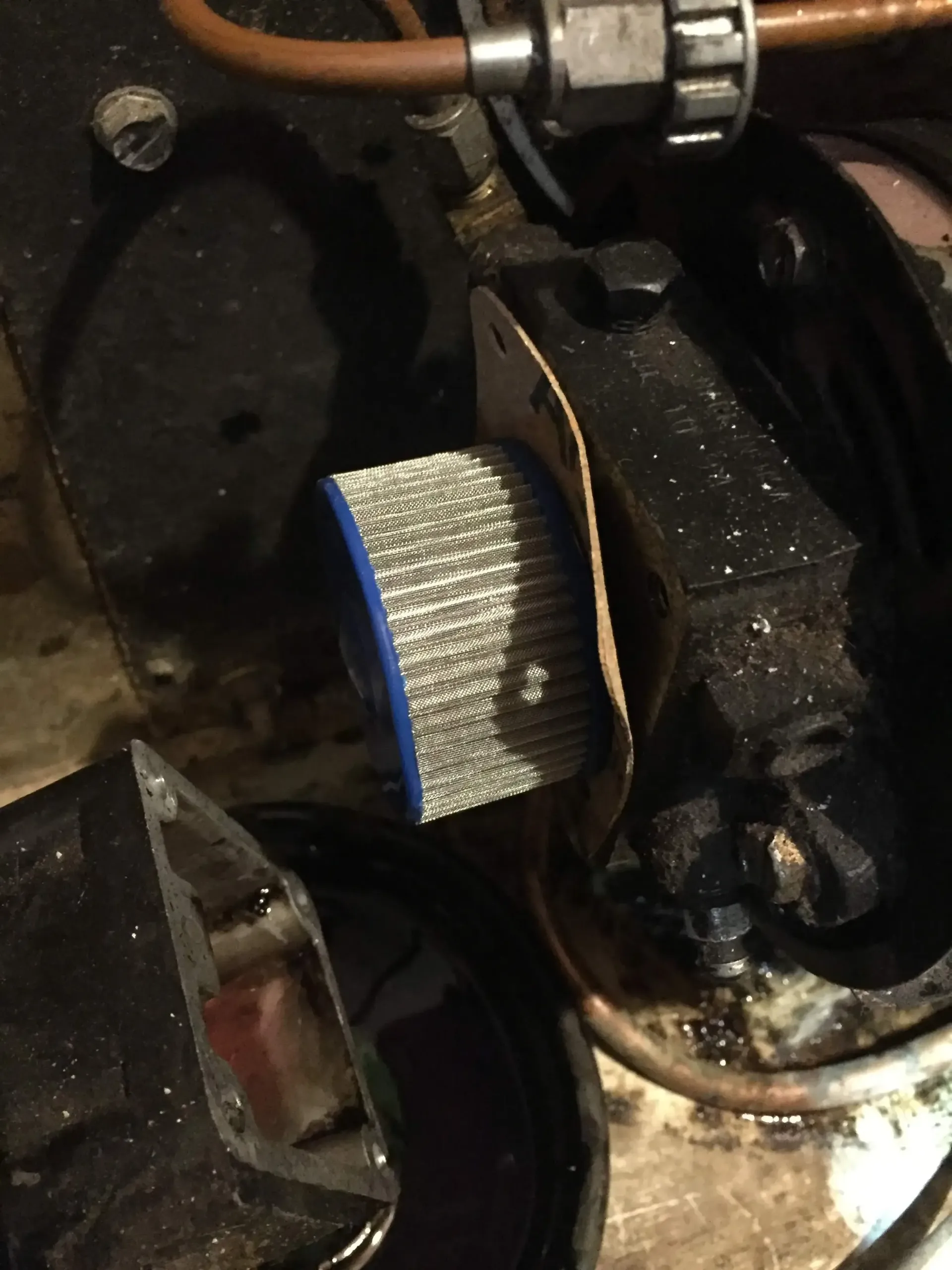 A close up of a piece of metal with a blue cap on it