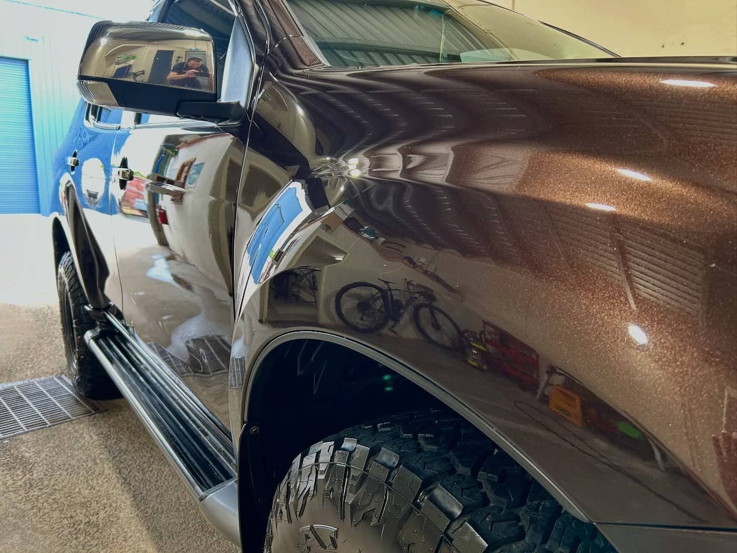 A Brown Pickup Truck Is Parked In A Garage — Tim Kratzke Detailing in Pialba, QLD