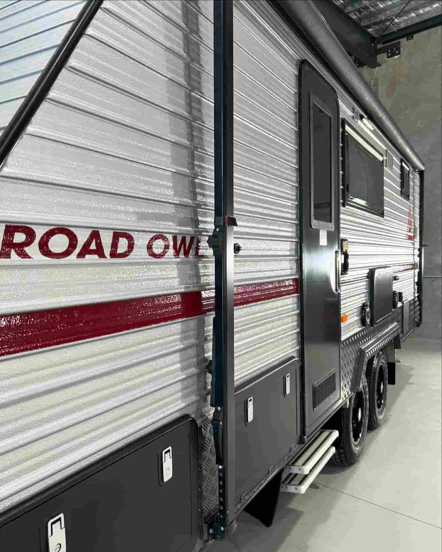 A White And Red Trailer Is Parked In A Garage  — Tim Kratzke Detailing in Pialba, QLD