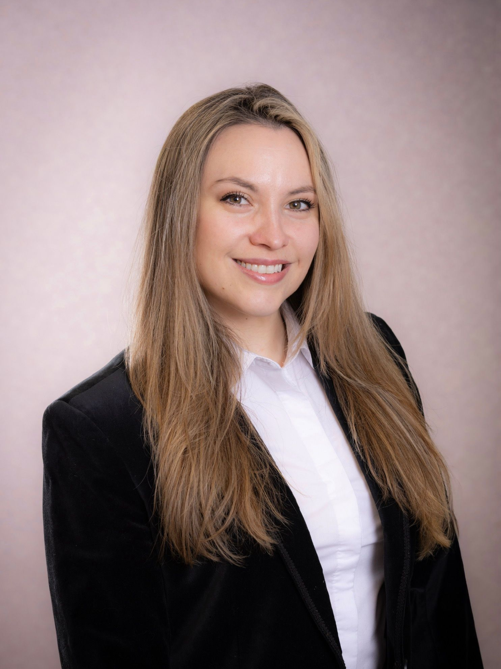 Professional headshot of a smiling person