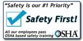Safety sign reading “Safety First!” with a blue checkmark and OSHA logo on a white background.