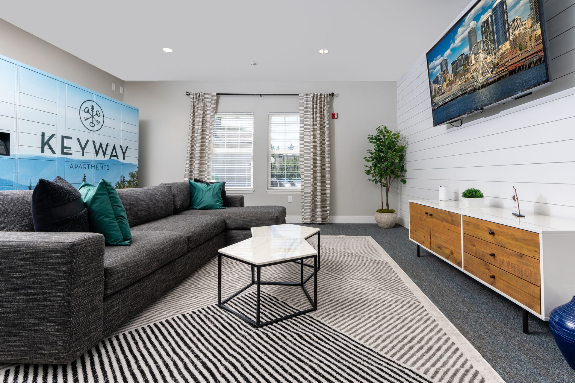 A living room with a couch , table , and television.