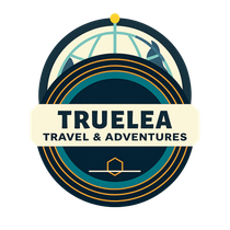 Logo for Truelea Travel & Adventures: text with compass rose, on gray background.