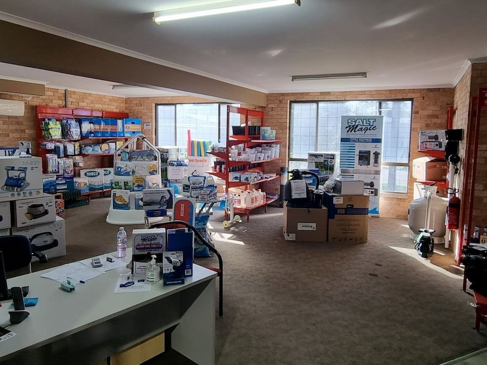 A Large Room Filled With Lots Of Shelves And Boxes — Manning Pools, Rubber & Foam In Taree, NSW