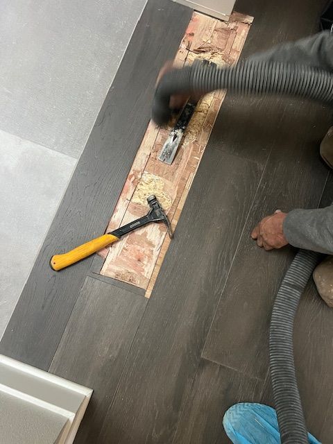 Repairing worn hardwood flooring in a Southern California home