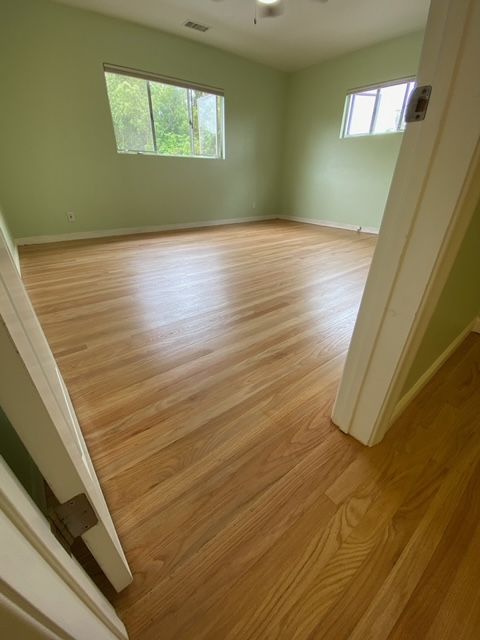 Sanding damaged hardwood floors for refinishing