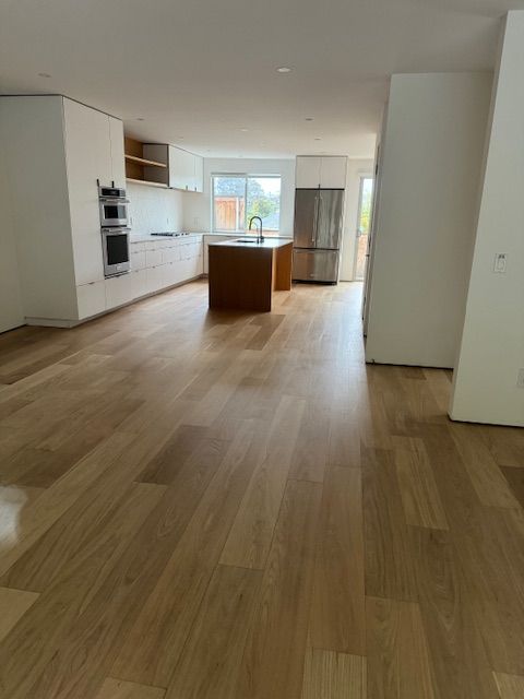 Residential hardwood floor preparation before refinishing