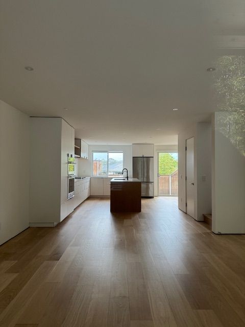Professional hardwood floor sanding project in a residential home