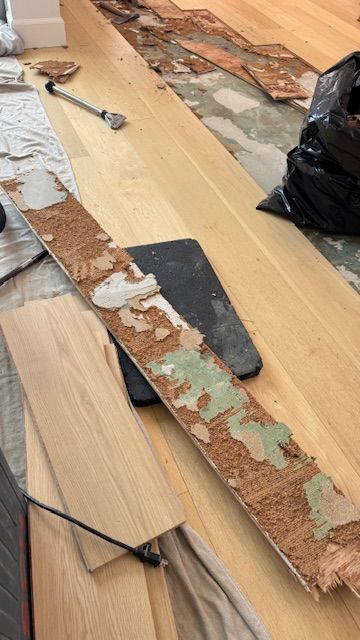 Repairing cracked laminate flooring planks in a home