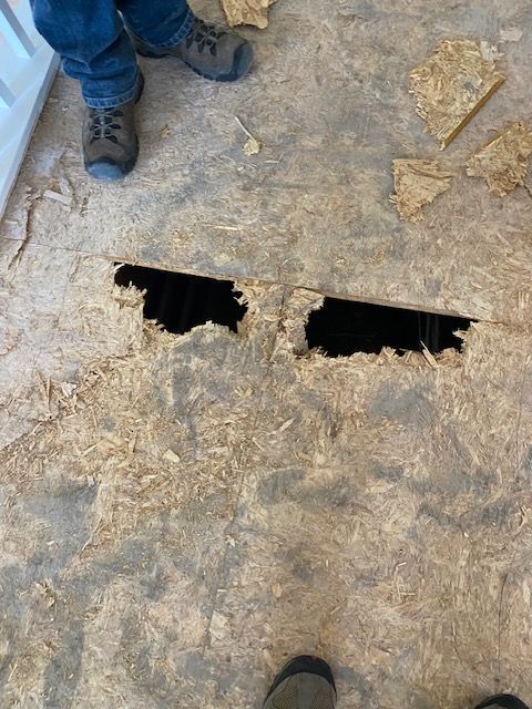 Repairing damaged flooring in a San Diego County residence