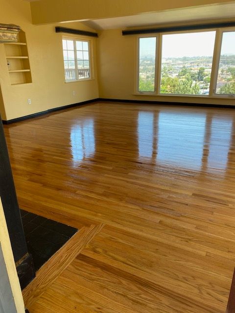 Detailed hardwood stain application and flooring restoration