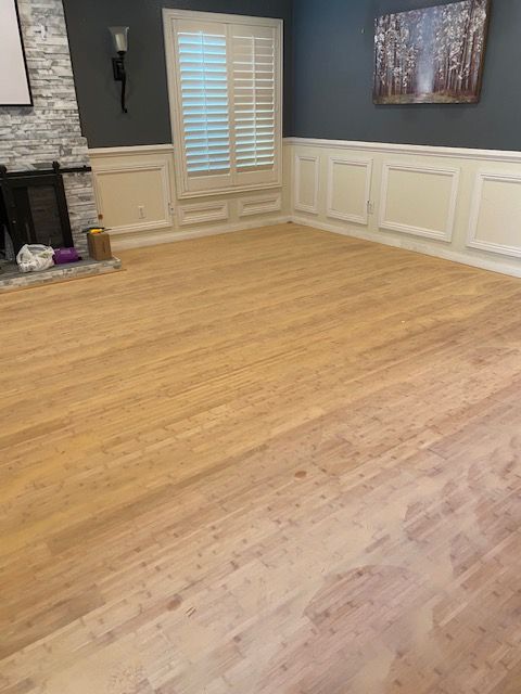 Freshly refinished hardwood flooring with a protective coating