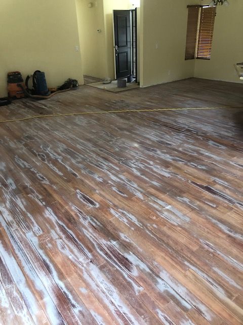 Detailed protective finish work on hardwood flooring