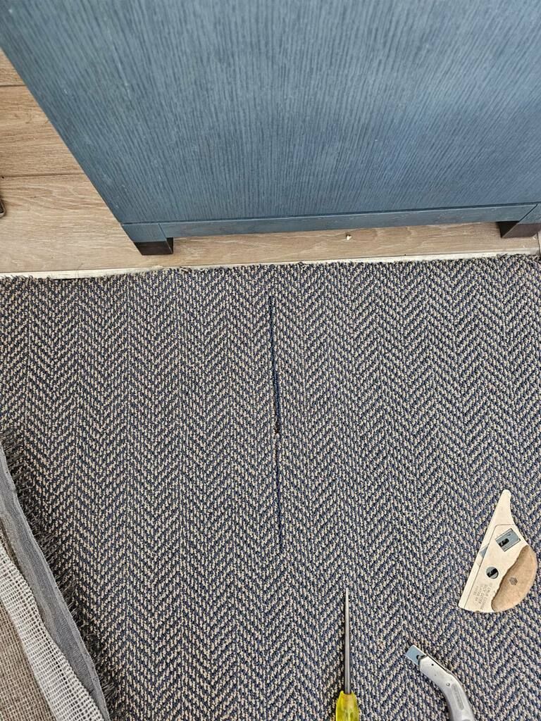 Repairing damaged residential carpet flooring
