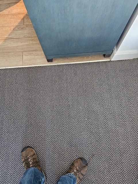 Repairing worn carpet areas in a Southern California home