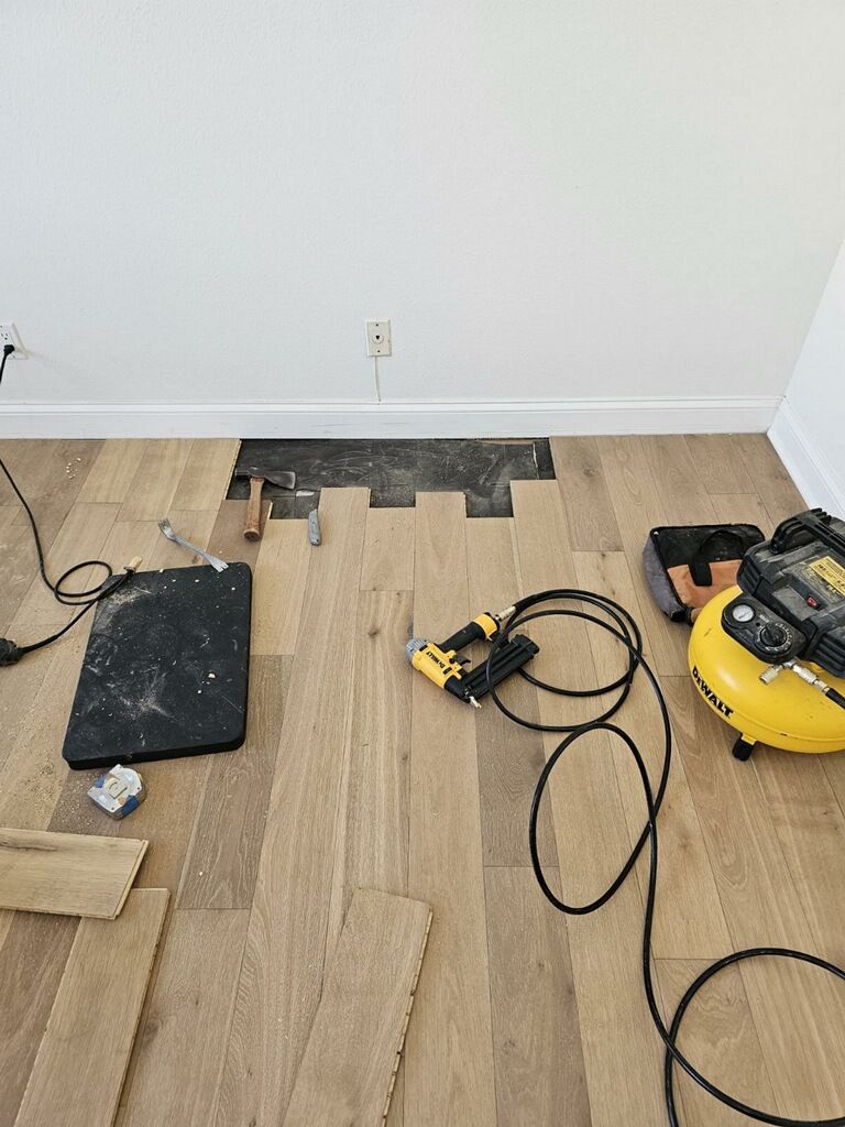 Professional replacement of damaged laminate floorboards