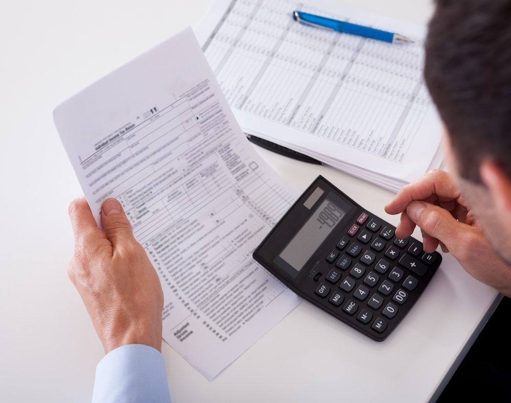 A Person is Writing Debt Consolidation in a Notebook — Repo Busters Wyong In Wyong, NSW