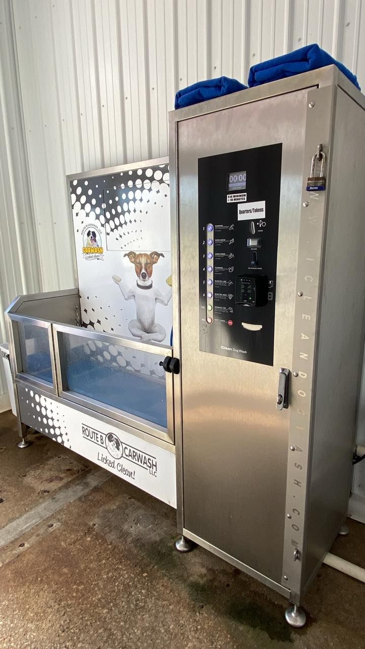 Stainless steel commercial appliance with black control panel and insulated compartment in a utility room