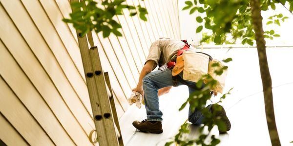 Man working on plumbing issue — Plumbers in Harlaxton, QLD