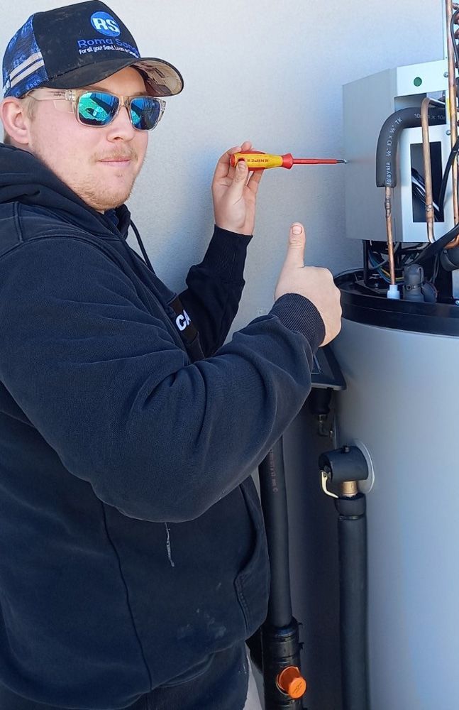 Plumber Fixing Building Water Heater