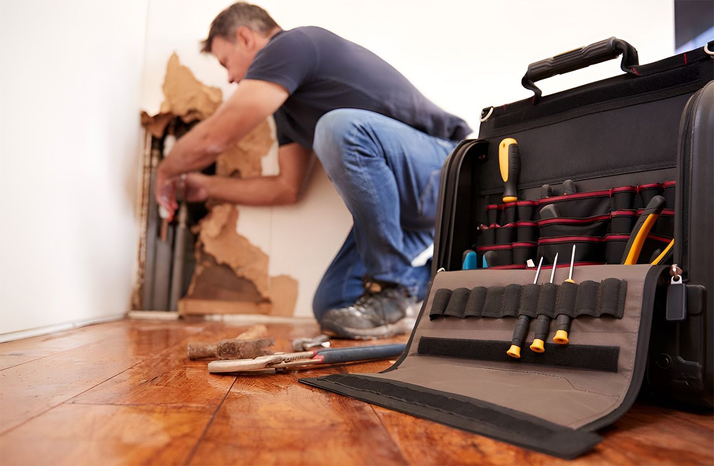 Plumber Repairing Pipes