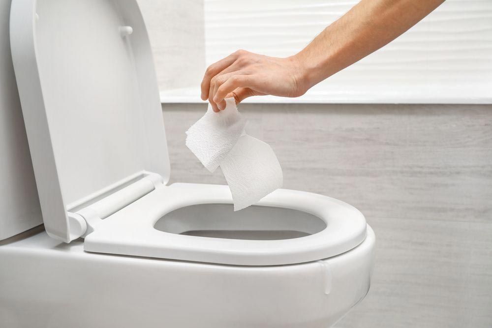 Throwing Tissue Paper On Toilet