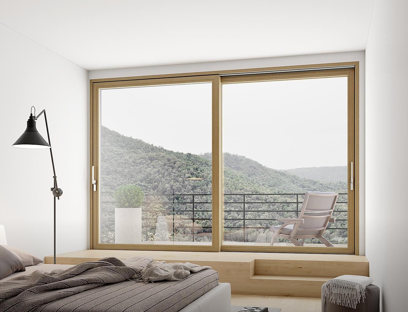 Camera da letto con ampia finestra con vista sulle montagne, una sedia e un letto con una coperta.