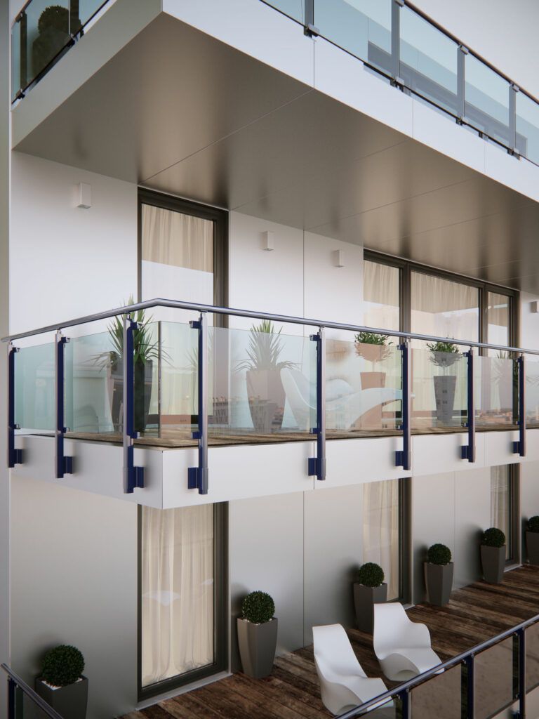 Edificio moderno con balconi e ringhiere in vetro.
